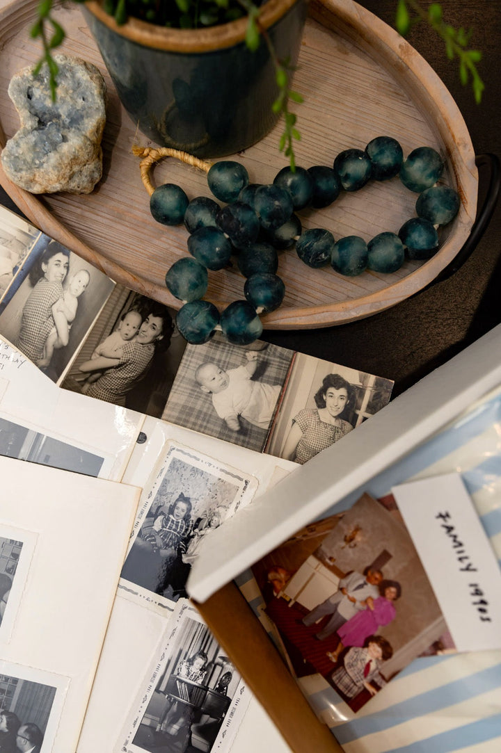 Vintage family photos and open albums arranged on a table
